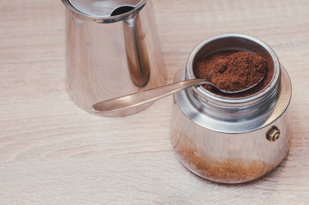 istock Disassembled coffee maker with a teaspoon of custard coffee 1447912287