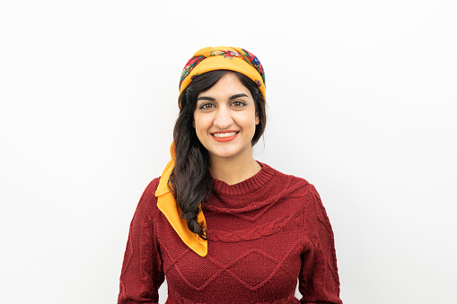 portrait of young adult middle eastern hijab woman with white background.