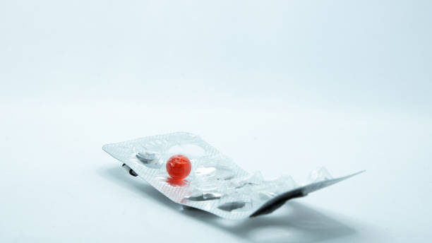 Blister with red pill. Vitamin E concept. stock photo