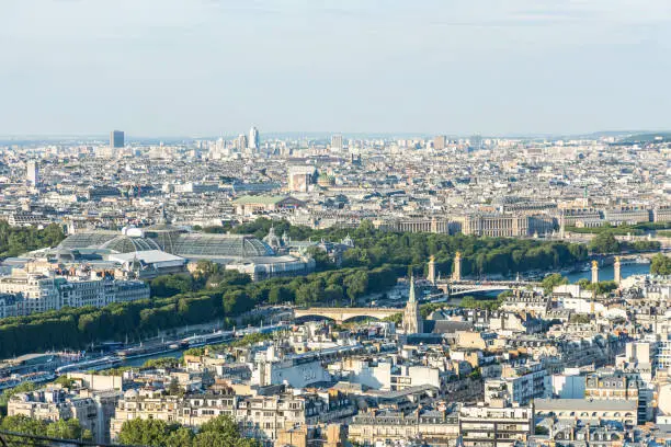 Photo of Pont Alexandre III bridge, Grand Palais and rooftops in Paris, France