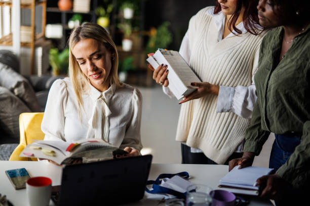 istock Three diverse female students gathering to study for exam together 1447925564