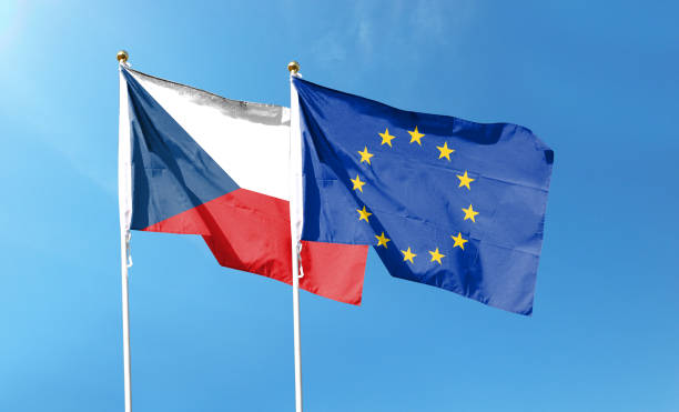 istock Czech and EU flags against cloudy sky. waving in the sky 1447927277