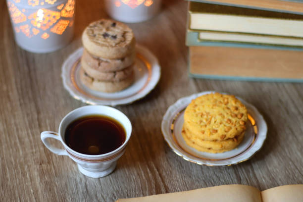istock Cookies, Tea, Books and Candles 1447937213