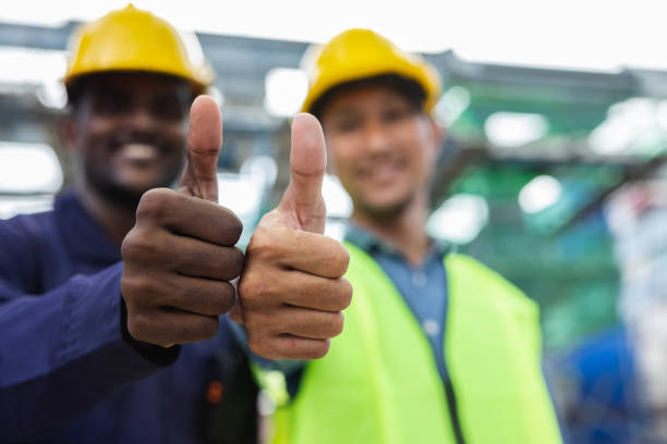 istock Team Construction worker standing with thumbs up Show confidence in working professionally. Great work and success in planning the work of the team. employment contract agreement 1447940248