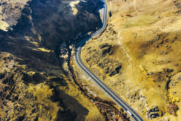 istock Drone Imagery of Road in Mountains 1447940545