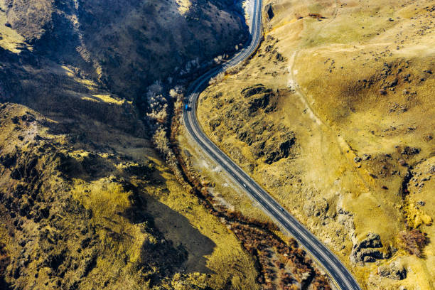 istock Drone Imagery of Road in Mountains 1447940744