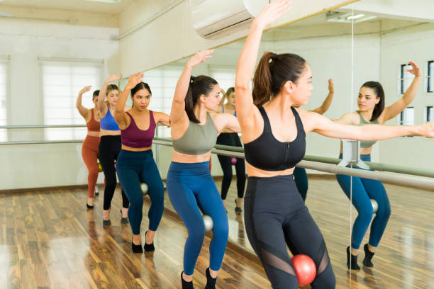 istock Fitness women during a barre class working out 1447942624