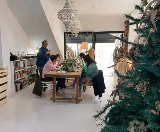 Female friends in a Christmas make-up workshop