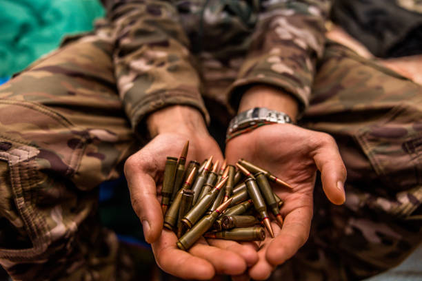 istock a grenade in a man's hand. Military man holding explosives 1447948295