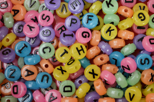 istock Colorful alphabet beads with letters. Close up view. 1447950685