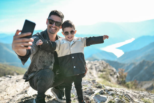 istock Funny Selfie By Happy Child And Father 1447952484