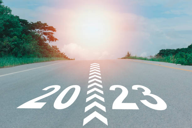 istock 2023, concept on the asphalt road, plan for future, optimistic landscape with sunset ahead, New Year template cerebration, keep walking on the street, slow life gold and happiness for 2023. 1447953534