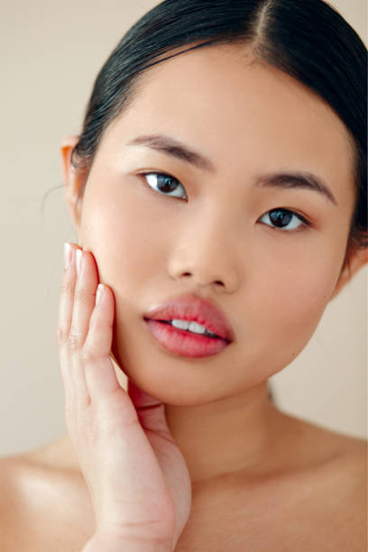 istock Beautiful Asian Woman With Posing In Studio Over Beige Background. 1447955165