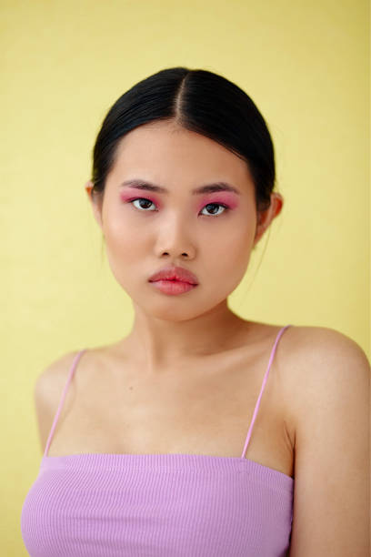 istock Beautiful Asian Woman With Colorful Makeup Posing In Studio. 1447955524