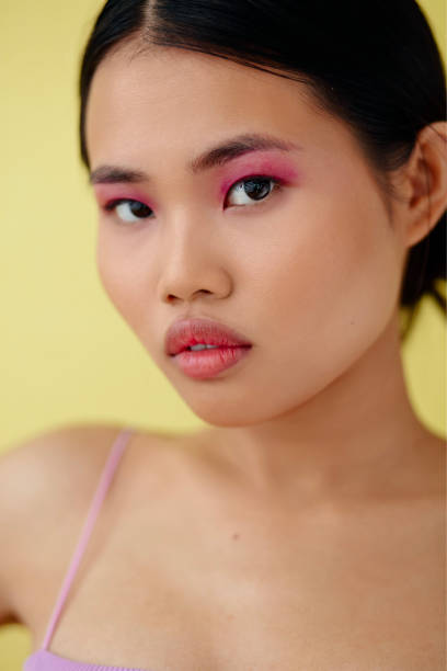istock Beautiful Asian Woman With Colorful Makeup Posing In Studio. 1447955525