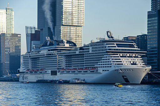 Rotterdam, The Netherlands, November 29, 2022: smoke from the chimneys of cruiseships moored at Wilhelminapier is becoming a major source of irritation for local citizens