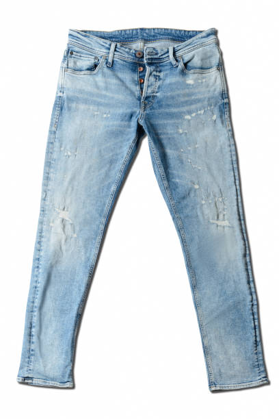 istock Ripped blue jeans on a white background. 1447959524