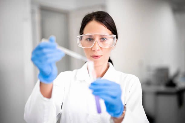 istock Brown haired female scientist seen using a pipette during some experiment in a laboratory 1447960621
