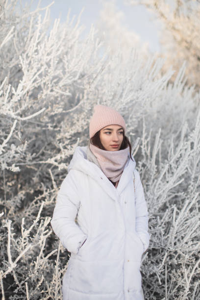 istock Woman in white jacket and scarf 1447962661