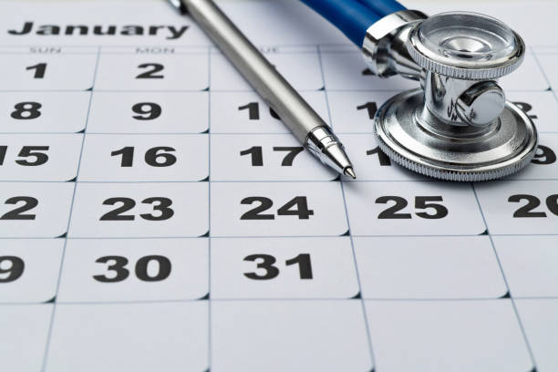 istock Stethoscope and pen on a calendar 1447963059