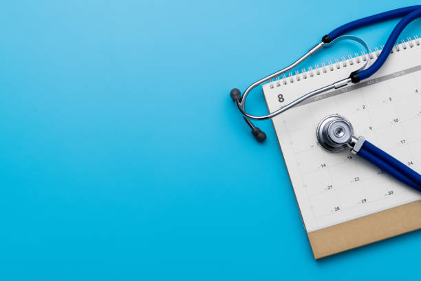 istock Stethoscope and pen on a calendar 1447963060
