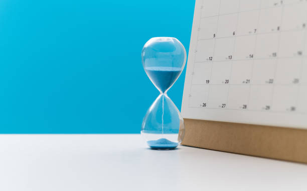 istock Calendar and hourglass on the table 1447963809