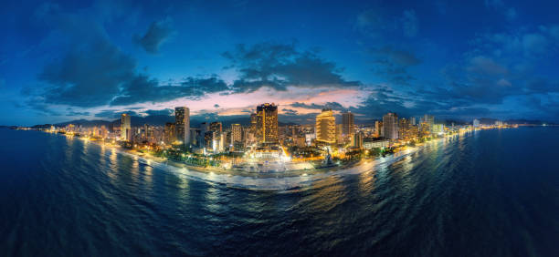 Drone view panorama Nha Trang city from the sea om sunset, Khanh Hoa province, central Vietnam