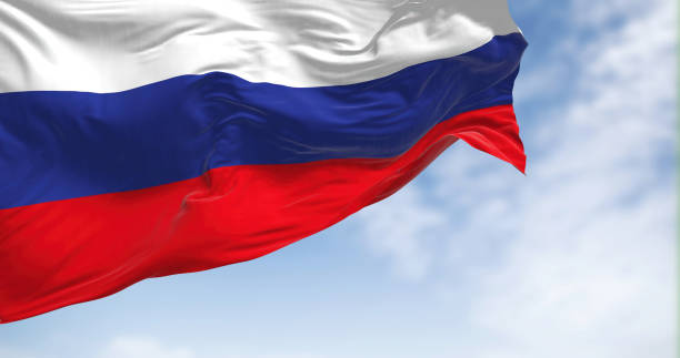 istock Russia national flag waving on a clear day 1447964059