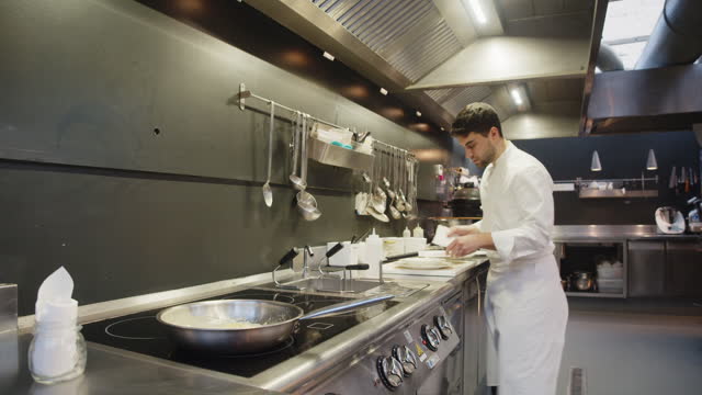 A chef is preparing food in the restaurant's kitchen