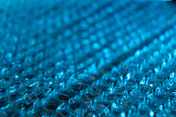 Close up of blue tinted bubble pack with lmited focus.