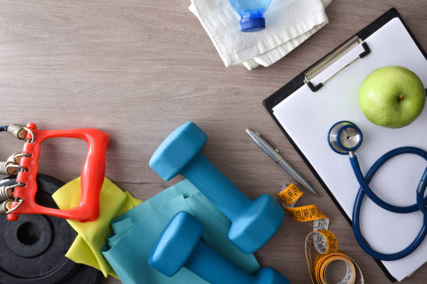 istock Physiotherapist workbench with notepad stethoscope and tools for sports 1447964356