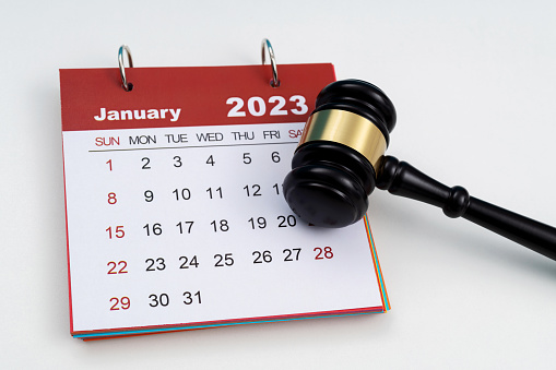 Calendar with gavel on the table.