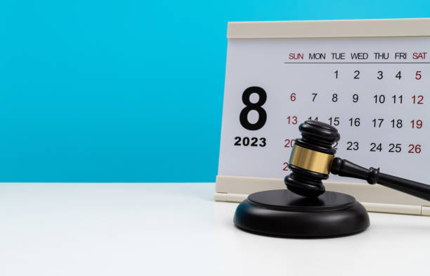 istock Calendar with gavel on the table 1447964443