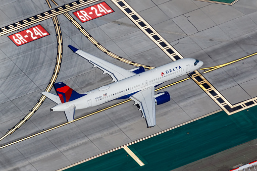 Los Angeles, United States - November 4, 2022: Delta Air Lines Airbus A220-300 airplane at Los Angeles airport (LAX) in the United States aerial view.