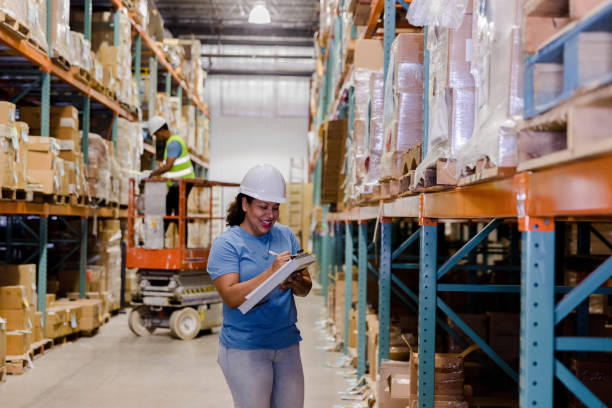 istock Diverse employees take inventory in supply warehouse 1447965784