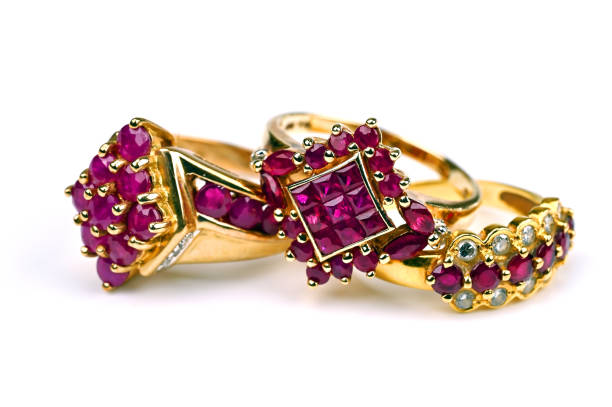 istock 3 gold rings with red stones 1447966134