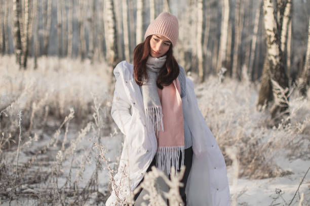 istock Woman in white jacket and scarf 1447966138