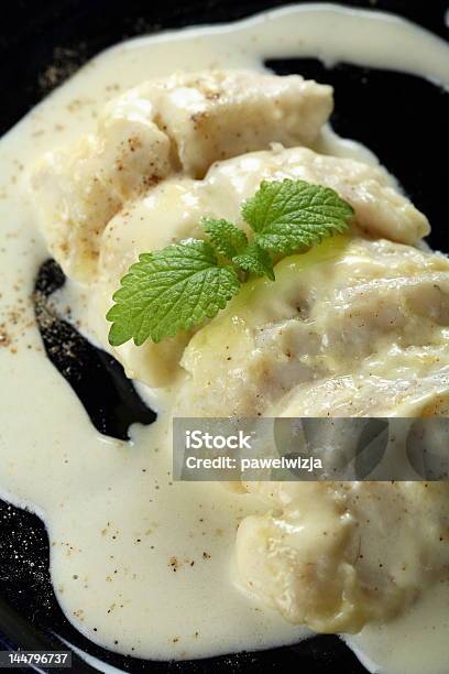 Stewed Cod With Creamy Dressing Stock Photo - Download Image Now - Cod, Cream Sauce, Black Background