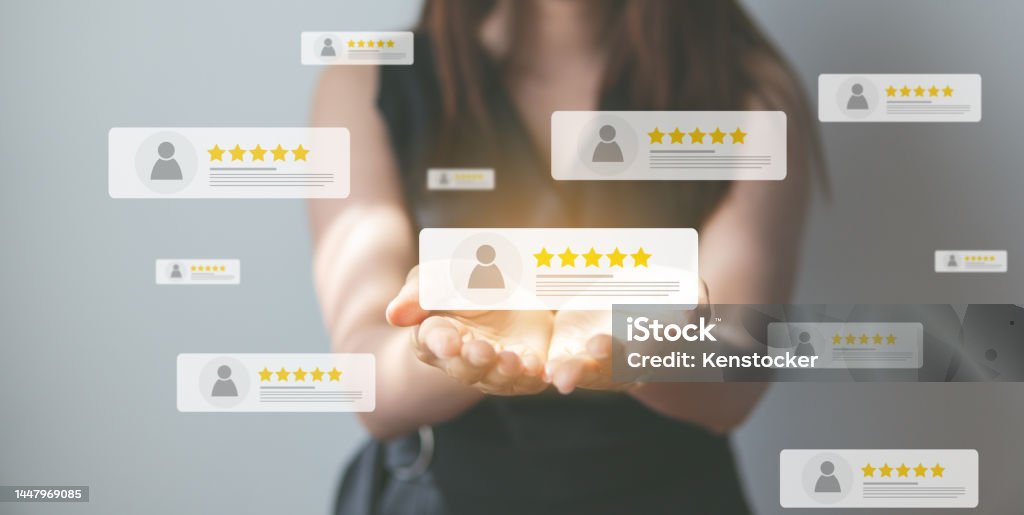 Business people using smartphone and pressing review popup on visual screen, customer review by five star feedback, positive customer feedback testimonial. Feedback Stock Photo