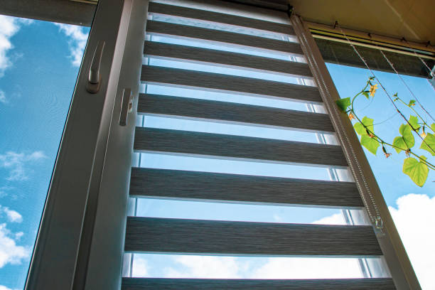 istock a plastic window open for ventilation with a roller blind and a mosquito net against the blue sky 1447969567
