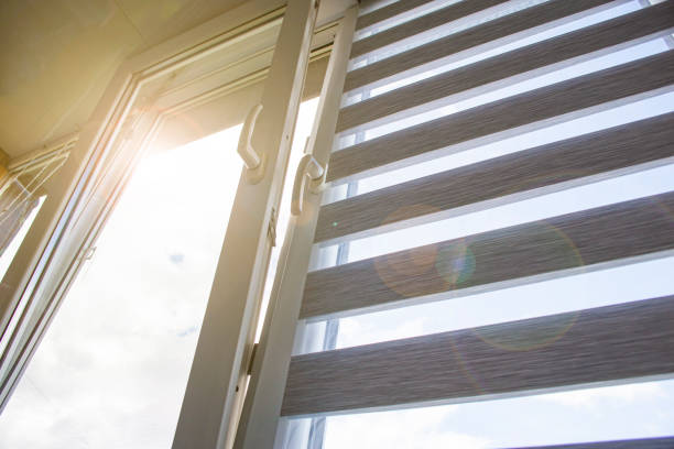 istock a plastic window open for ventilation with a roller blind and a mosquito net against the blue sky 1447969573