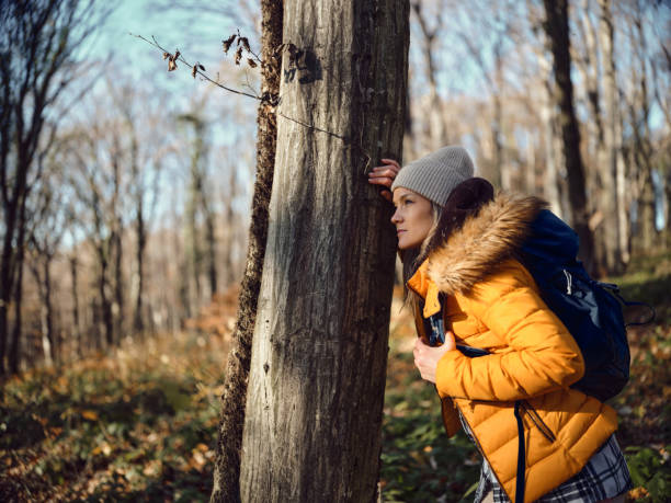 istock Pensive female backpacker on a break in nature. 1447970385