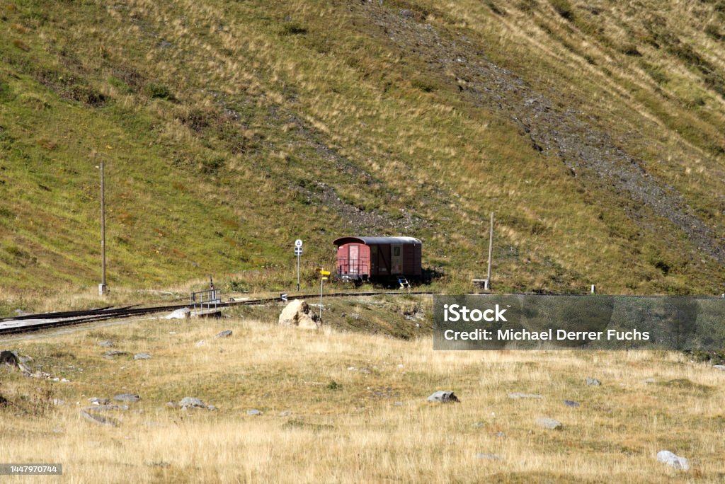 Aerial scenic landscape in the Swiss Alps with railway track at region of Swiss mountain pass Furkapass on a sunny late summer morning. Photo taken September 12th, 2022, Furka Pass, Switzerland. Backgrounds Stock Photo