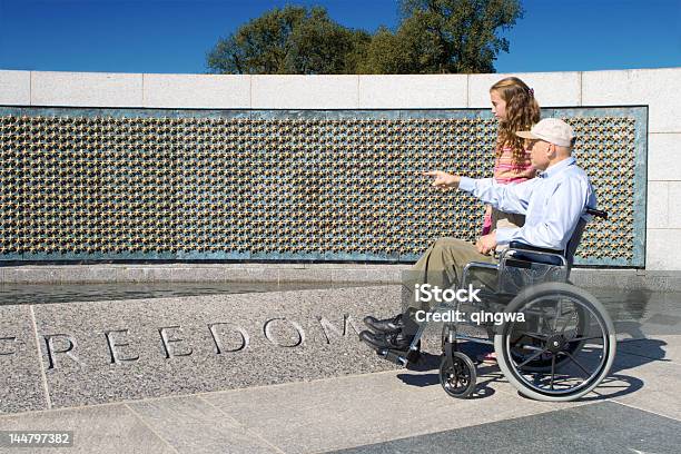 Grandfather In Wheelchair And Granddaughter At World War Ii Memorial Stock Photo - Download Image Now
