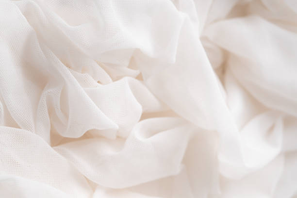 istock WHITE BACKGROUND OF SILK CLOTH 1447977299