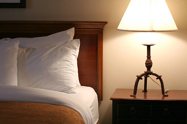 istock Lamplit serene and cozy bedside at night 144797770