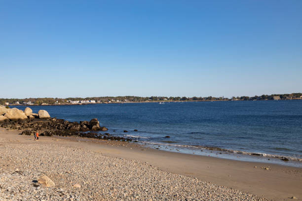 istock People at a rocky beach 1447978244