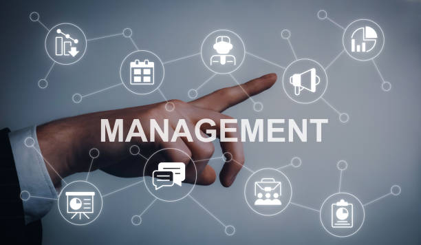 istock Business management closeup concept image with white glyph icons 1447979701