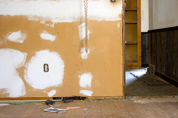 Grungy Home in need of repair. Old home built in 1902 is being remodeled and now has the carpet taken out and the walls are being primed with plaster and mudd. shoddy remodeling work avoid.