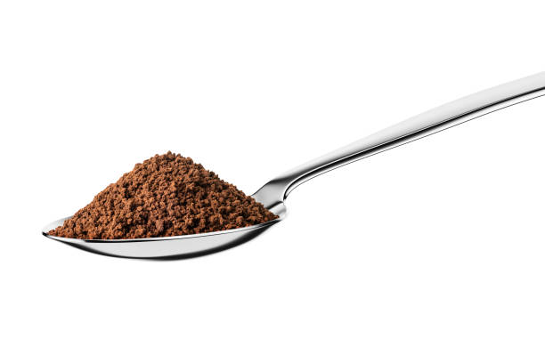 istock Teaspoon with instant granulated coffee isolated on white. 1447981328